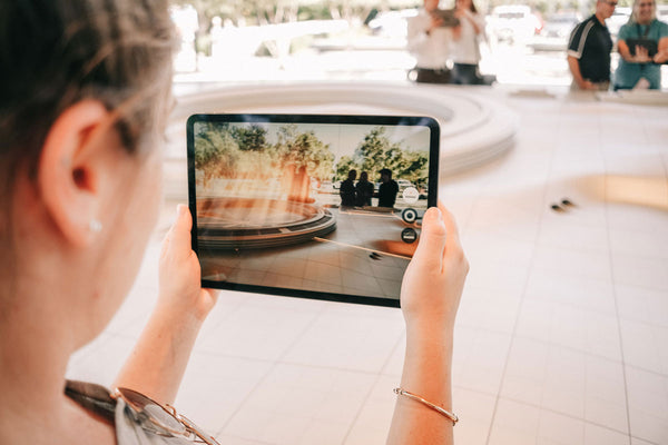 Free Woman Holding Ipad Pro Mockup