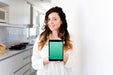 Free Woman In Kitchen Presenting Tablet Mockup Psd