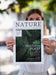 Free Woman Showing A Nature Magazine Mock Up Psd