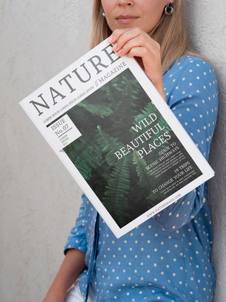 Free Woman Showing A Nature Magazine Mock Up Psd