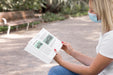 Free Woman Wearing Mask On Street Reading Book Psd
