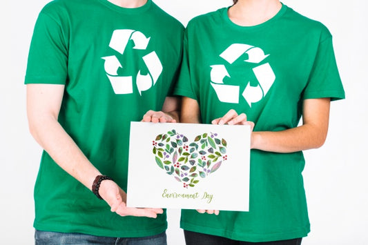 Free World Environment Day Mockup With Volunteer Couple Holding Paper Psd