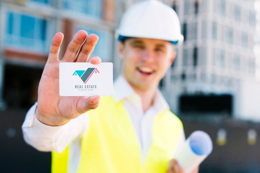 Free Young Architect Holding A Business Card Psd
