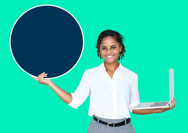 Free Young Businesswoman Holding A Blank Circle And A Laptop