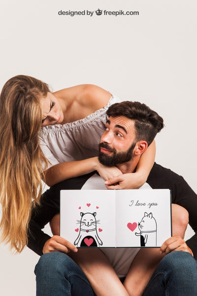 Free Young Couple Holding Open Book Psd