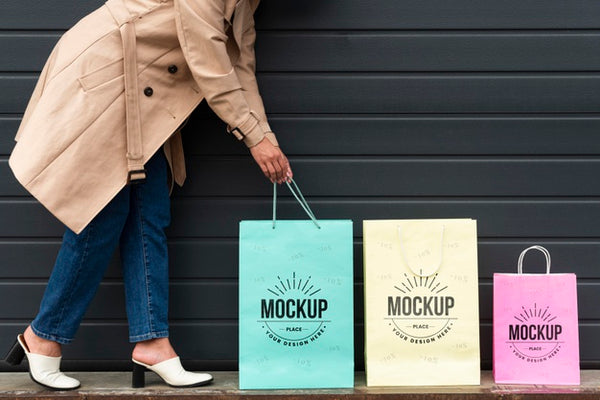 Free Young Woman Standing Next To Shopping Bags Psd